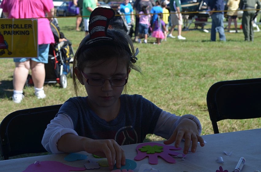 Domenica Cambell works on a craft.