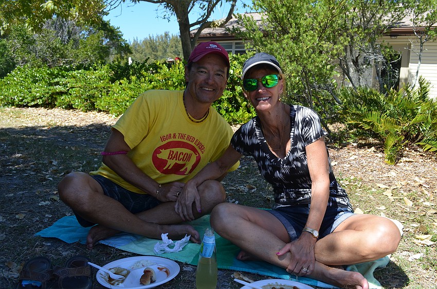 Lee and Sue Falcenstrom sit in the shade.