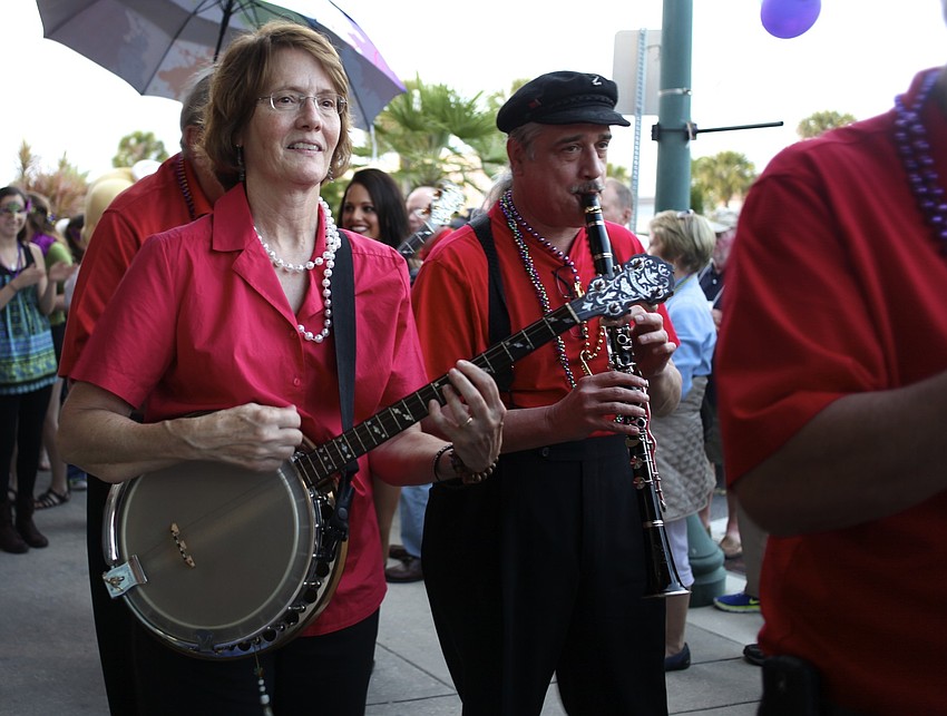 Nancy Leipold plays the banjo along with the band.
