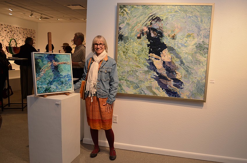 Jean Blackburn between her work 