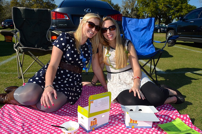 Sisters Christa and Kelly Hall enjoy the sunshine.