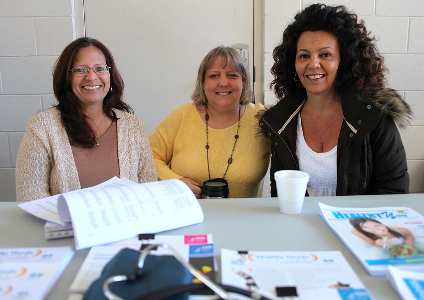 Susan Smith, Sandy Henley and Lisa Silvertooth educate the community about budget and wellness.