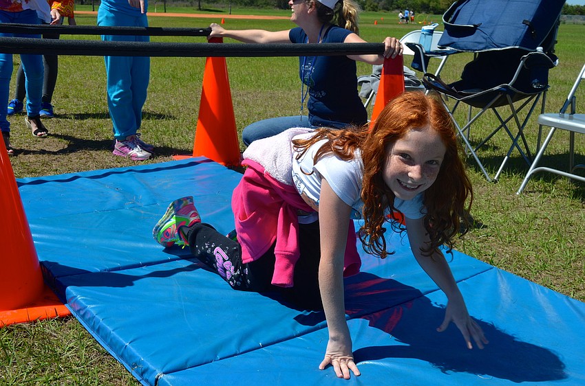 Marissa McCauley, 9, takes a break from exercising.