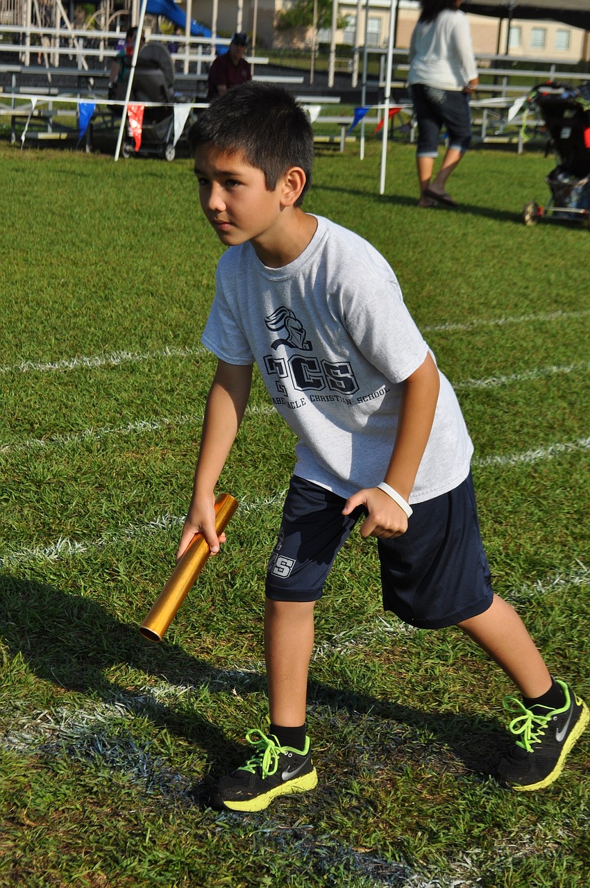 Shane Foley leads his teamâ€™s leg of a relay race.
