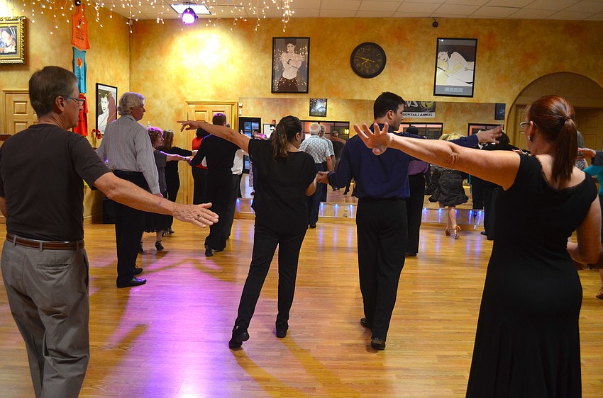 Jonathan Roberts, center, leads participants in a dance lesson.