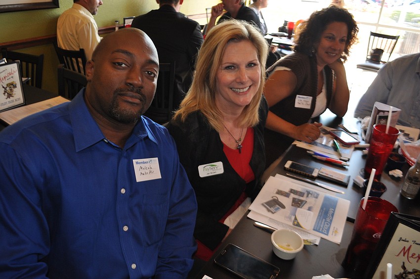 Malcolm Hale, of Metro PCS, chats with Jen Brown, of PayServ