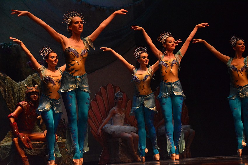 Mermaids dance in celebration of sea life.