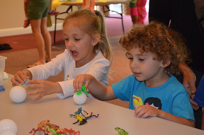 Ella Brucksieker and Cara Sheyner play at one of the stations.