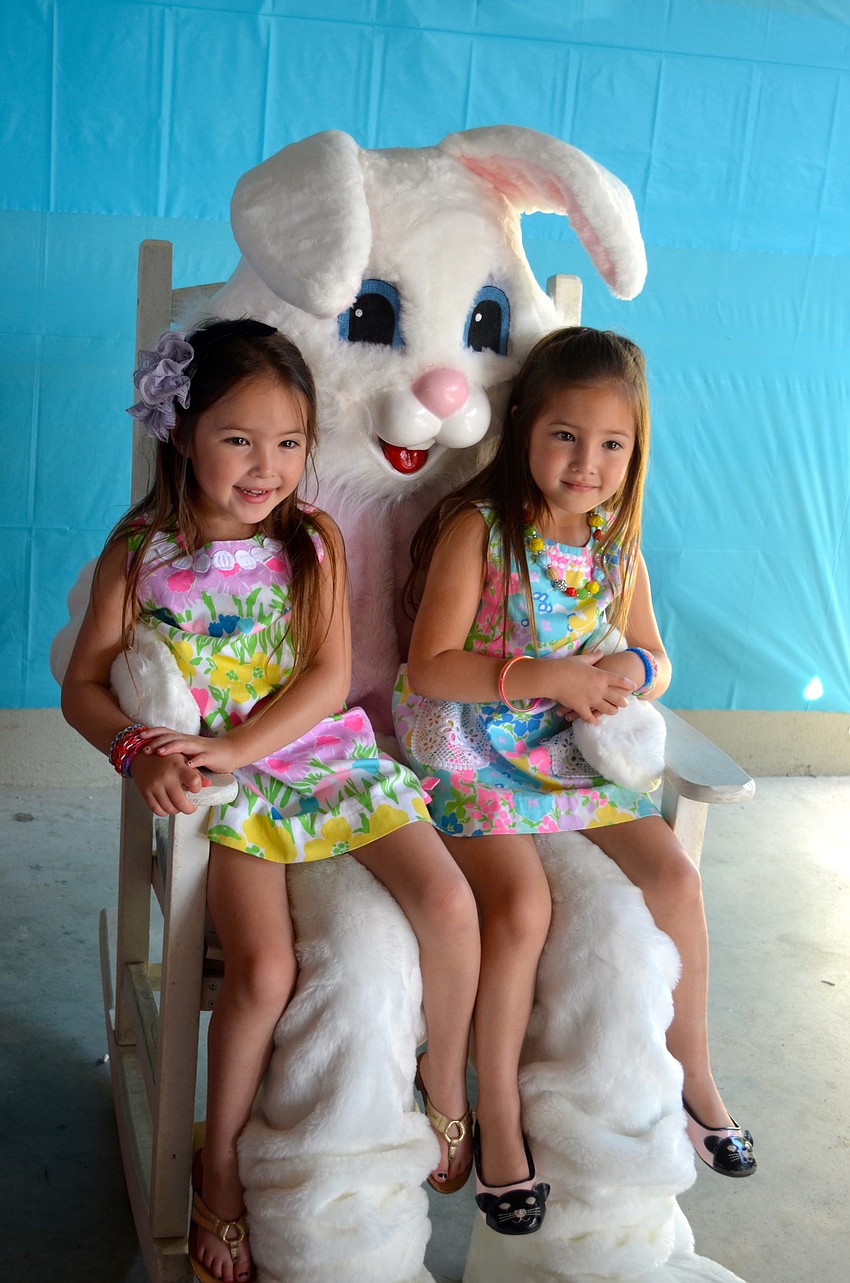 Five-year-old twins Aidan and Adelle Reed sit with the East Bunny.