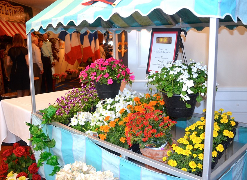 The partyâ€™s decorations included a colorful flower cart.