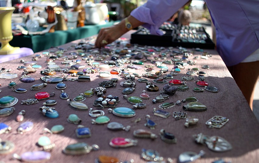 Festivalgoers look through sterling silver and semiprecious jewels from Delilahâ€™s Treasure Chest.