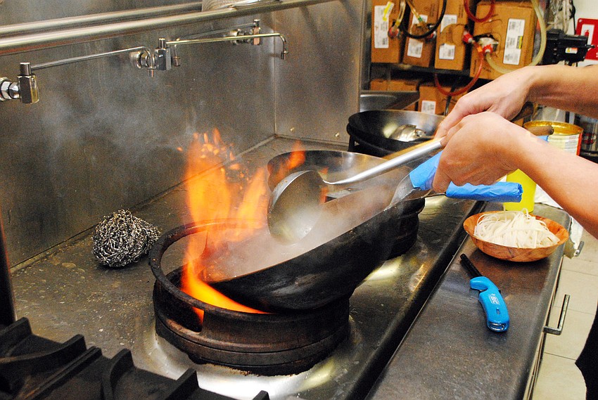 Chef Lam Lum prepares Koor Mee Lao