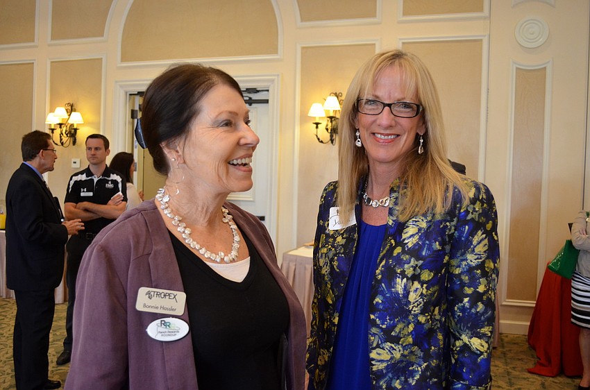 Bonnie Hassler and Darla Phagan enjoy socializing after the presentation.