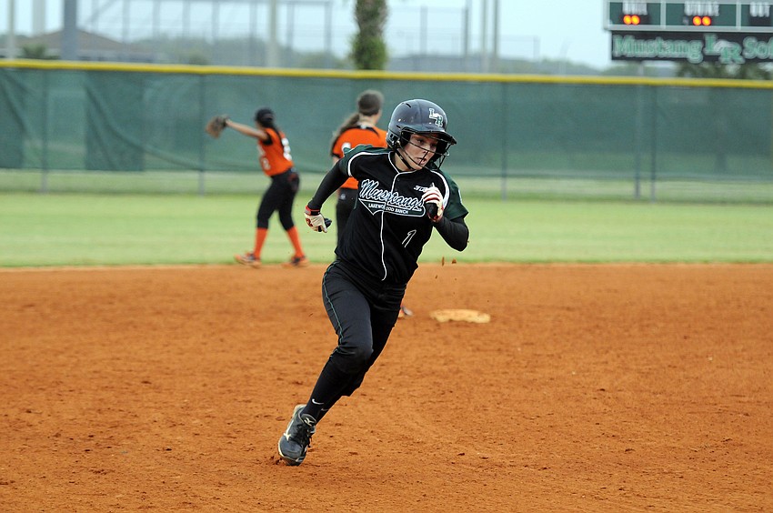 Lakewood Ranch leadoff hitter Jackie Schoff rounds third base and heads for home plate in the bottom of the first inning.