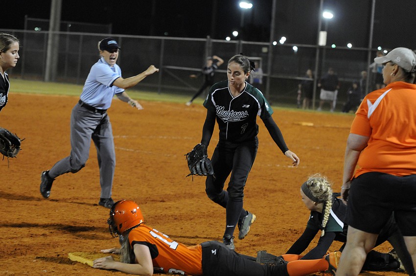 Sarasotaâ€™s Hannah Roberson is caught in a rundown in the top of the fourth inning.