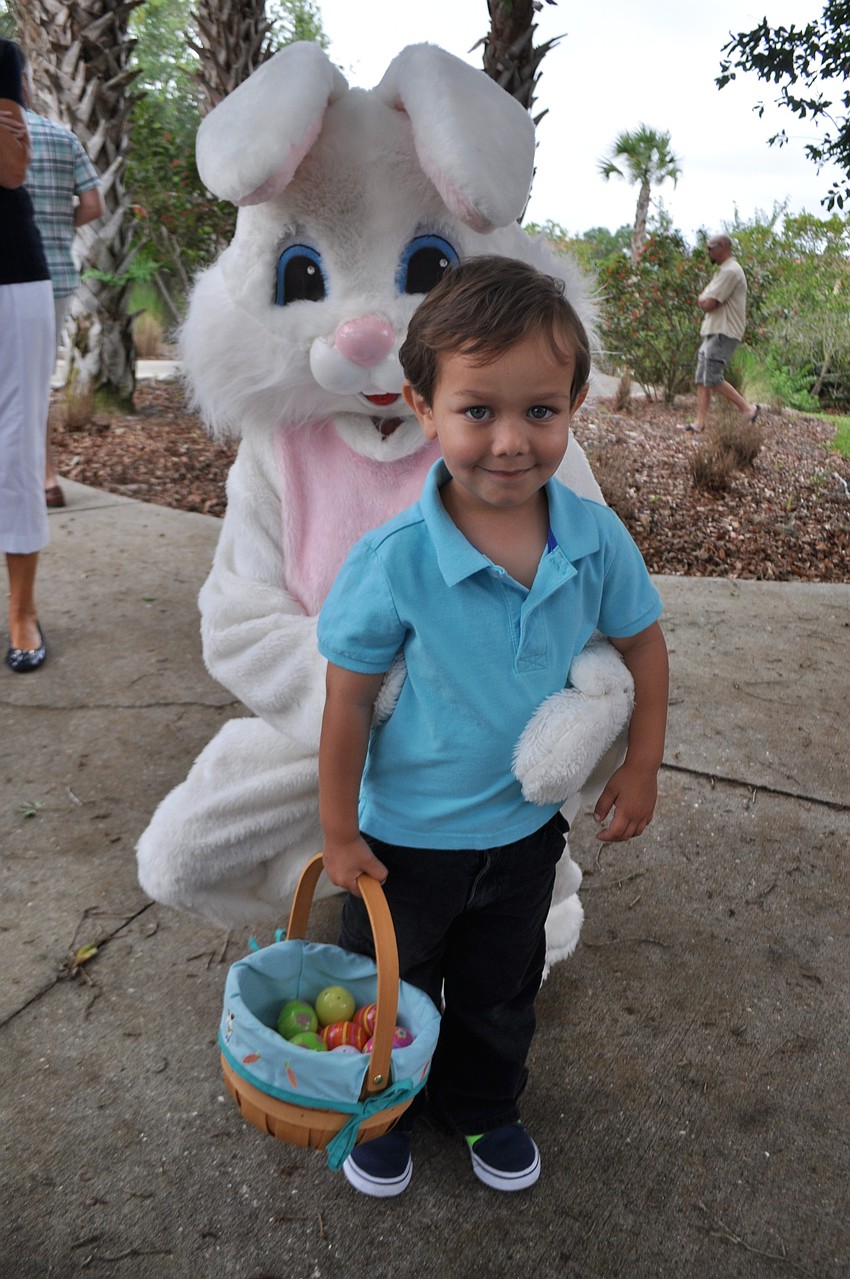 Jace DeGregory makes sure to visit with the Easter Bunny.