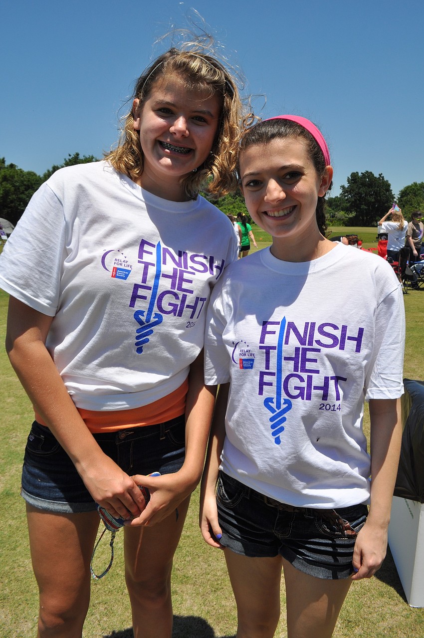 Jenny Antonino and Alison Greenfield, of Lakewood Ranch High School, walk with team Purple Novas.