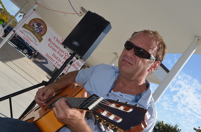 Bryan Spainhower entertains community members with Spanish guitar tunes.