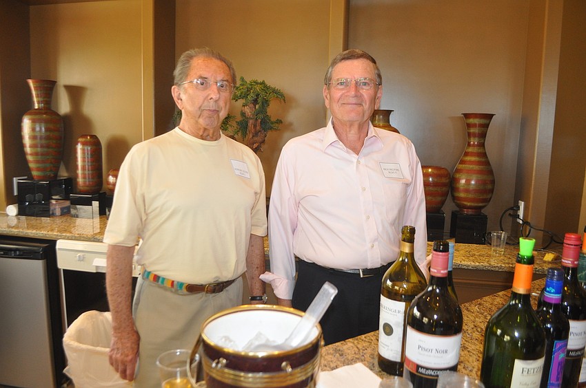 Howard Silver and Rich Belford tend bar.
