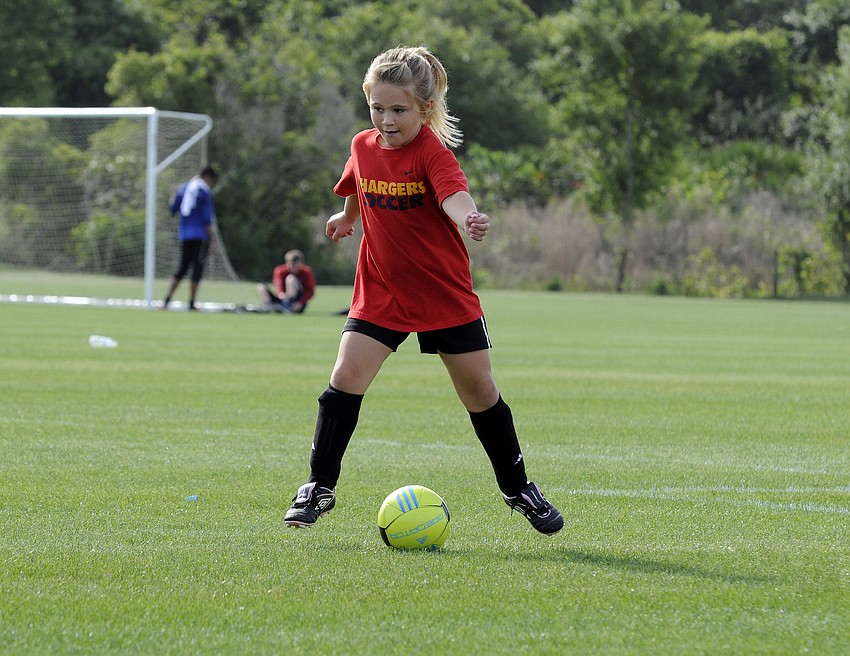 McNeal Elementary School kindergartner Mary Catesâ€™ favorite part of soccer is scoring goals.