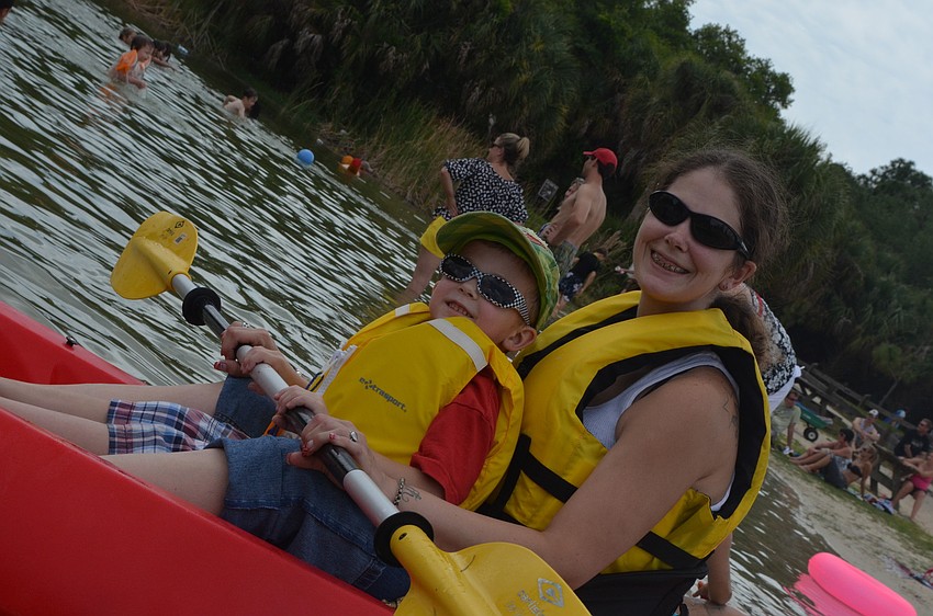 Noah and Rebecka Rohlfing get ready to paddle out.