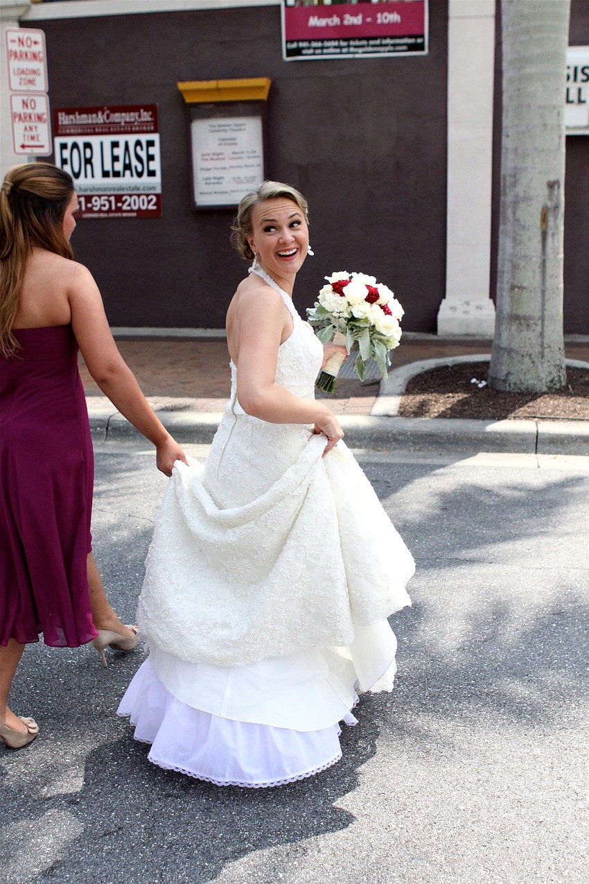 Emily Forbes crosses the street during a quick photo session before the wedding.
