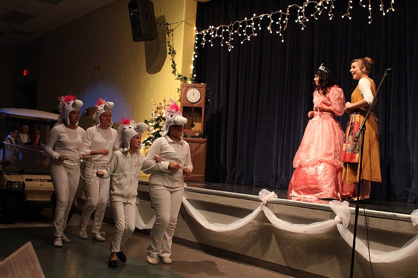 Fairy Godmother, Madi Jojeda, and Cinderella, Paige Merriman, react to the pumpkin carriage and the white mice that turned into horses.