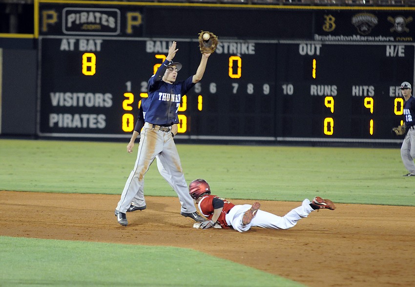 Sophomore Jake Romine tags second base before attempting to throw out the runner at first base.