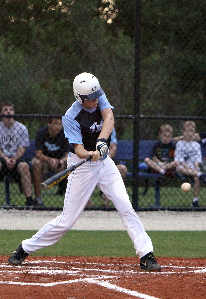 Out-of-Door Academyâ€™s Alex Horan, No. 11, goes to hit the ball.