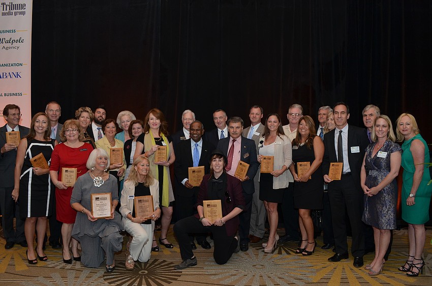 Finalists and winners gathered together to take a group photo with their plaques.