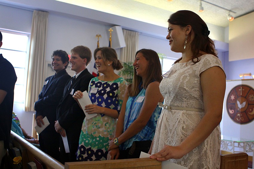 Some of the scholarship students begin to laugh during a story that was told about scholarship recipient Savannah Schield.