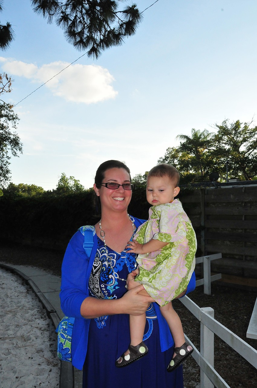 Jennifer LaFemina and her niece, Reese Lawrence, celebrate on the playground after a successful Pre-K graduation.