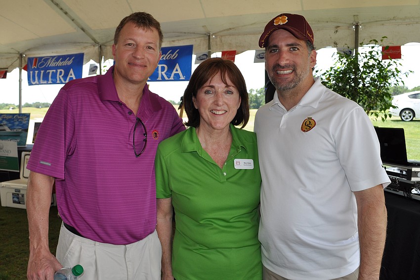 Jeff Johnson with Manatee Education Foundation Director Glass Manatee and Manny Arisso