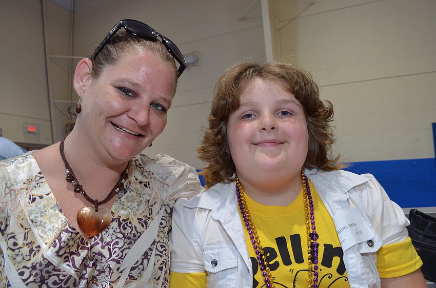 Melissa Smith helps her daughter Wilkerson Elementary fourth grader Sierra prepare for the spelling bee.