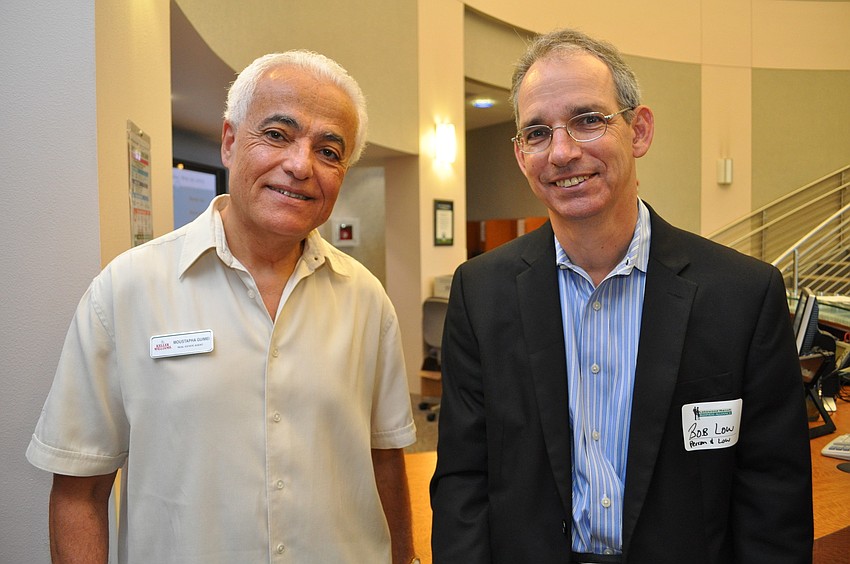 Moustapha Guimei, of Keller Williams, and Bob Low, of Perron & Low