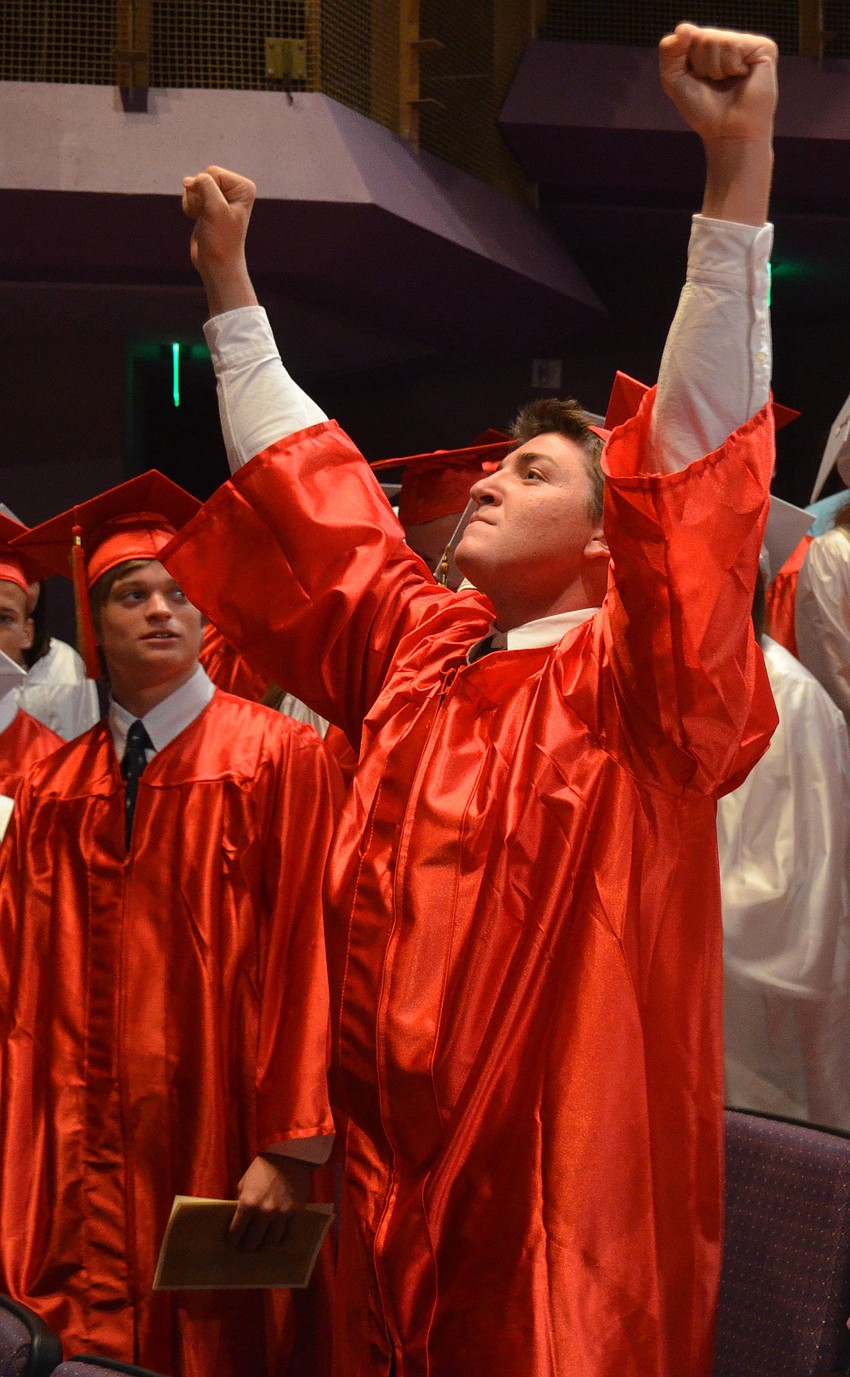 A student celebrates graduation.