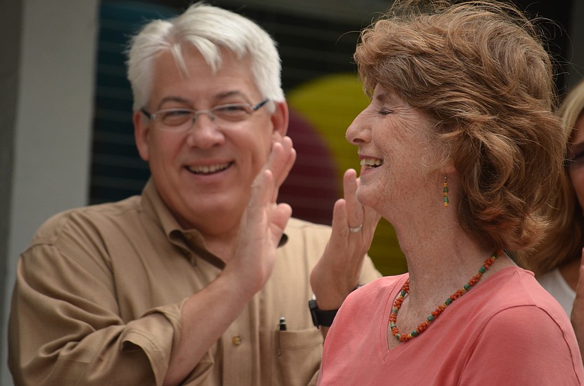 ODA Board Chairman Mike von Waldner claps for Glendy Huene as she finds out the library was renamed in her honor.