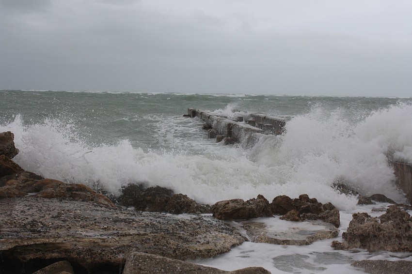 Tropical Storm Andrea blasts waves against a derelict pier at Sunset Point on Siesta Key.