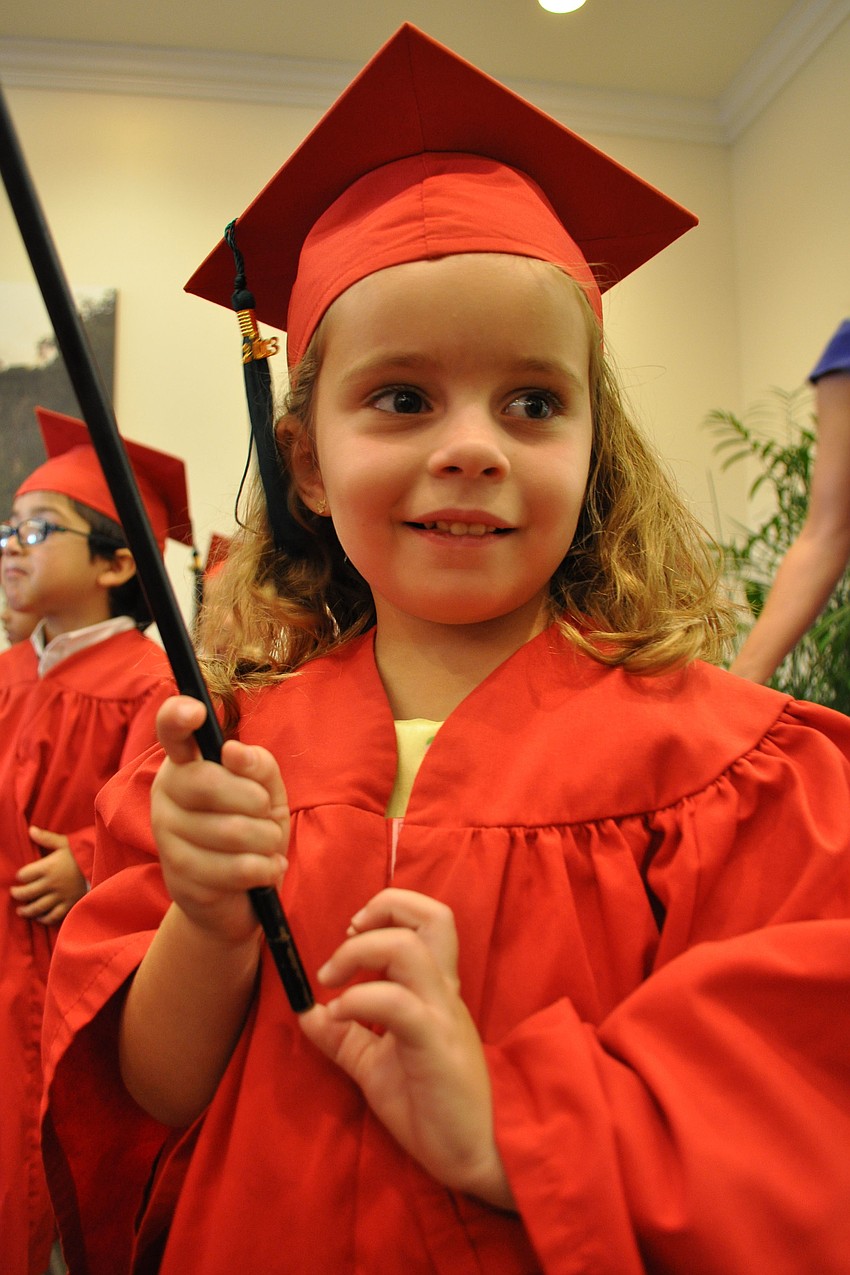 Skyla Murphy is one of four Primrose students to walk in with a flag.