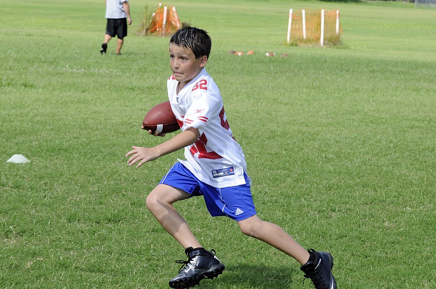 Eight-year-old Matt Depalma plays running back for the Lakewood Ranch YMCA Colts.