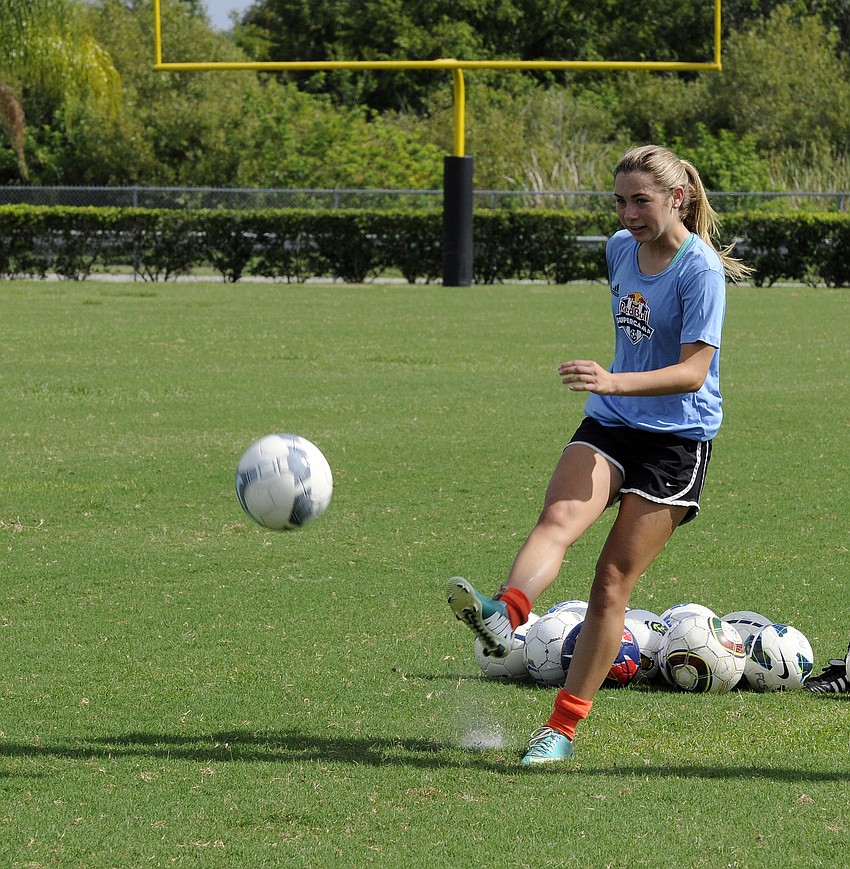 Cardinal Mooney senior Anna Brusco fires off a shot to one of the campers.