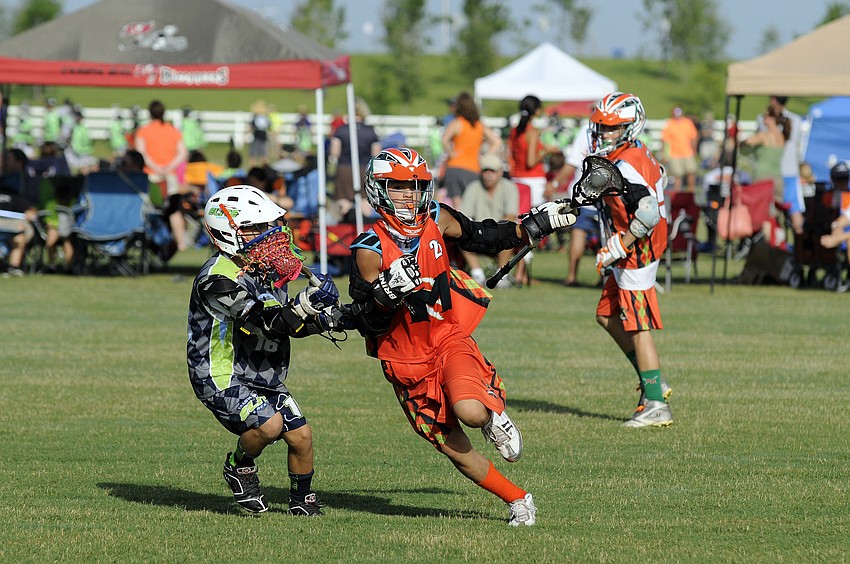 Eleven-year-old Ryan Bolduc attempts to maneuver around a Tampa Elite defender.
