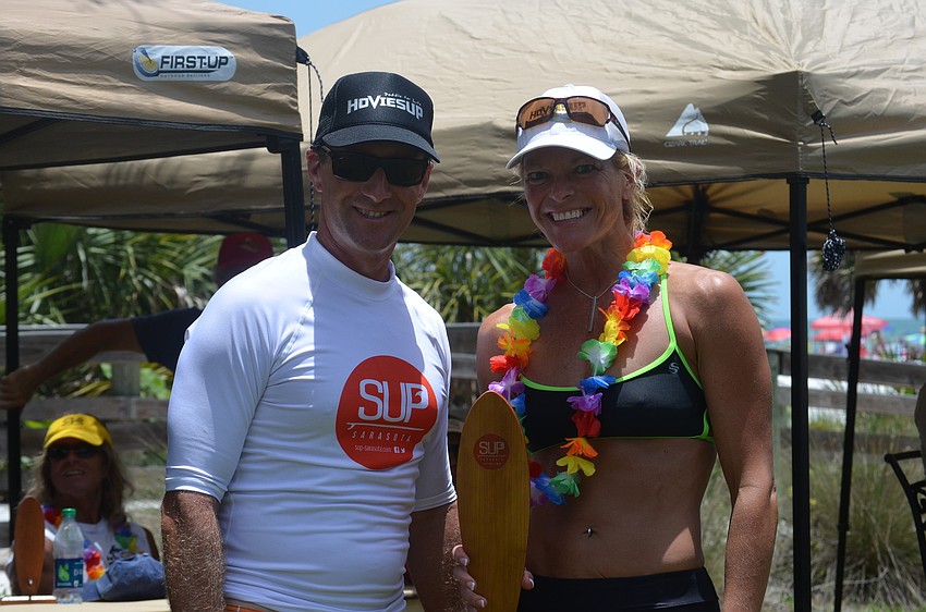 Founder of the Sarasota Stand Up Paddle Board Series Rob Alfieri and first place winner of the womenâ€™s open Karen Wiegandt