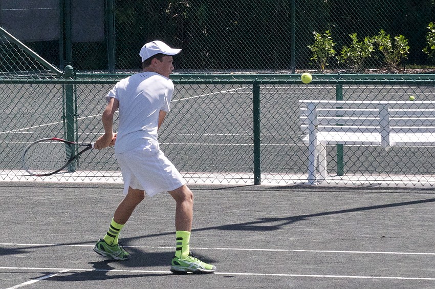 Nick Carter, 14, pummels a tennis ball across the court scoring a point in the tennis game â€œTug-a-war.â€