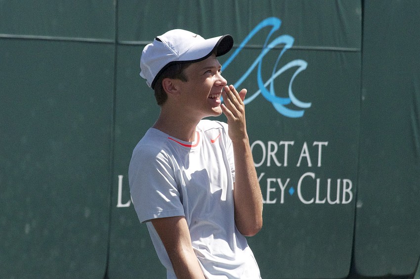Nick Carter, 14, laughs during a game of tennis â€œTug-A-war.â€