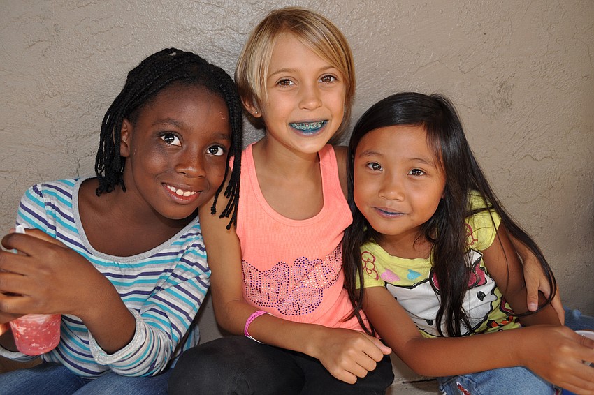 Betchina Bellevue, Sage Scrimale and Nikki Relao cool off with snow cones.