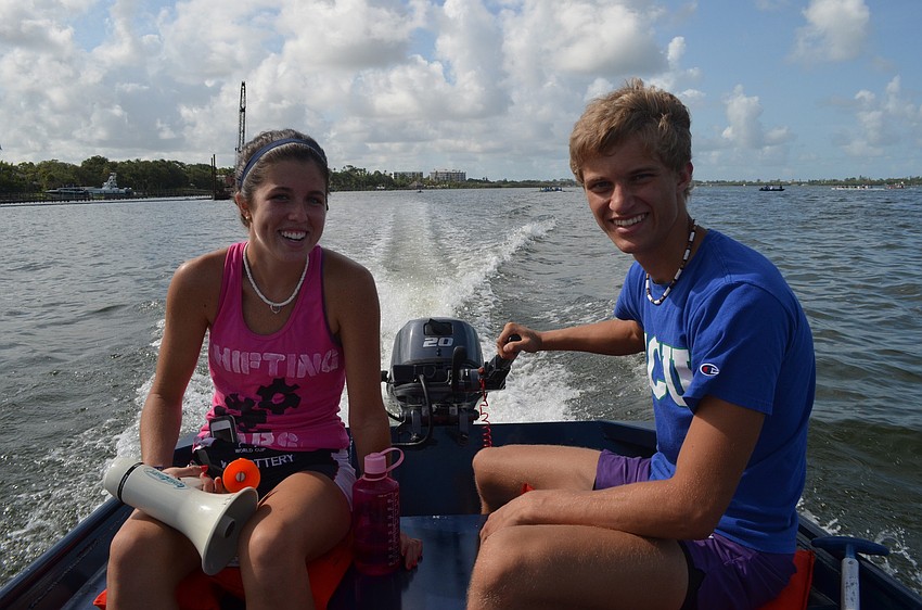 Camp councilors Cassidy Marryott and Drake Stevens helped start the races at the mini regatta.