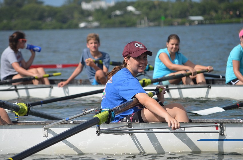 Sarah Schoeffe rows with fellow campers.