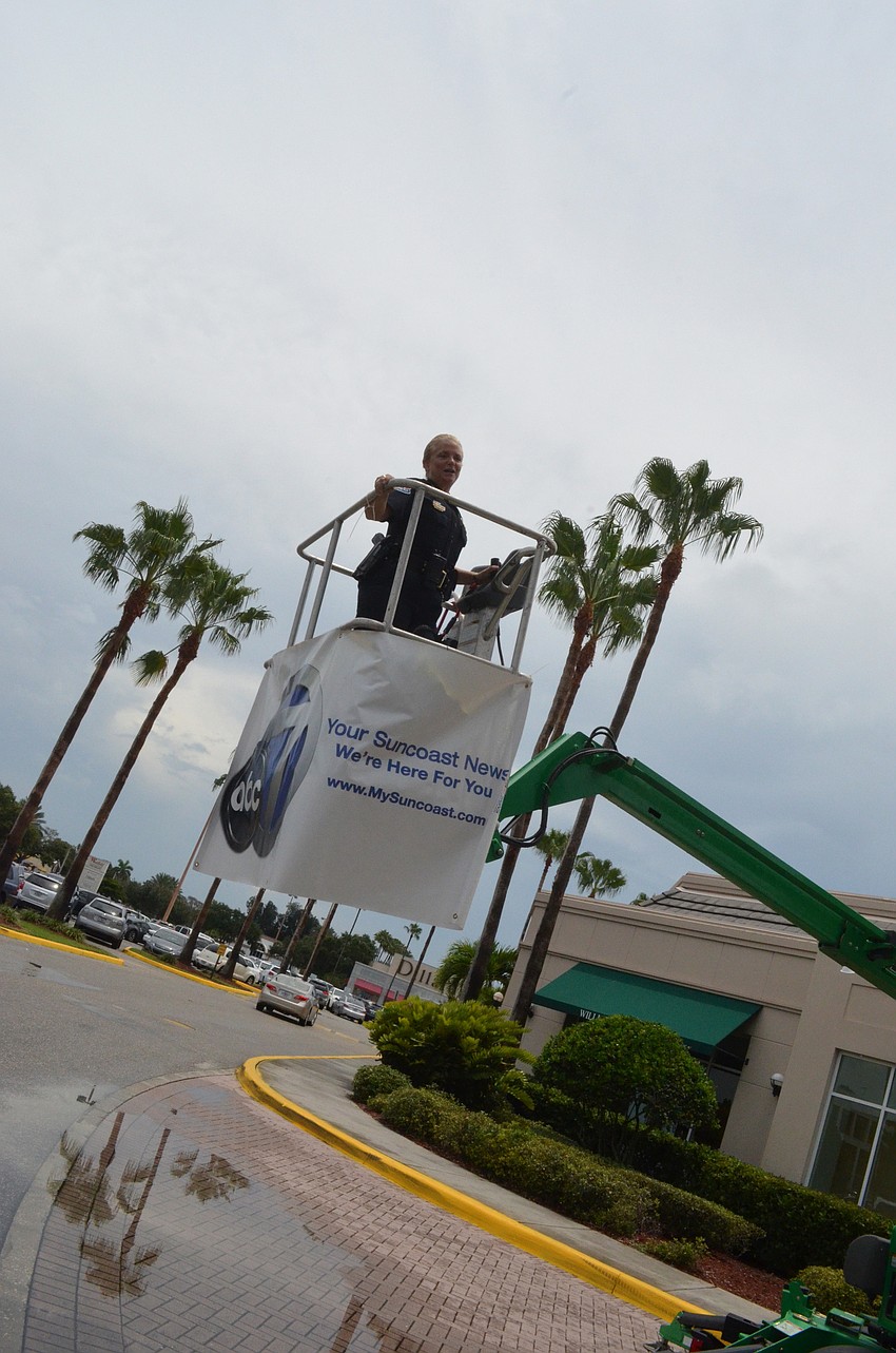 Sarasota Police Chief Bernadette DiPino stayed in the makeshift bucket in the air from 1 p.m. to 2 p.m.
