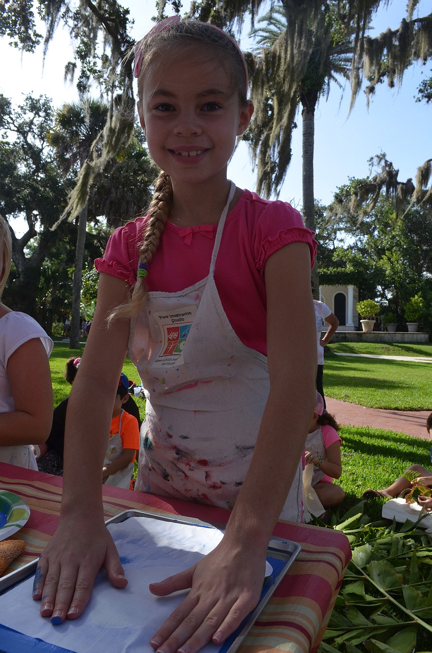 Samantha Summerlin, 8, works on her printmaking project.